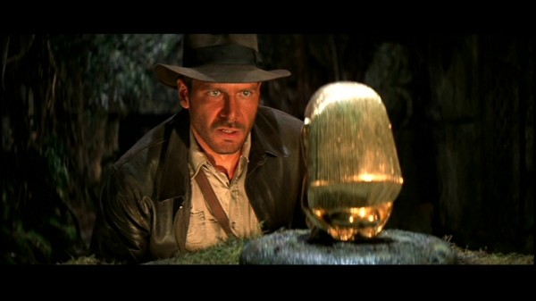 Indiana Jones hesitates to take the idol, unsure whether the Incas forged it during the steroid era.